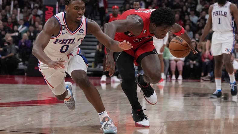 Oct 28, 2022; Toronto, Ontario, CAN; Philadelphia 76ers guard Tyrese Maxey (0) plays for the ball with Toronto Raptors forward O.G. Anunoby (3) during the fourth quarter at Scotiabank Arena. Mandatory Credit: Nick Turchiaro-USA TODAY Sports