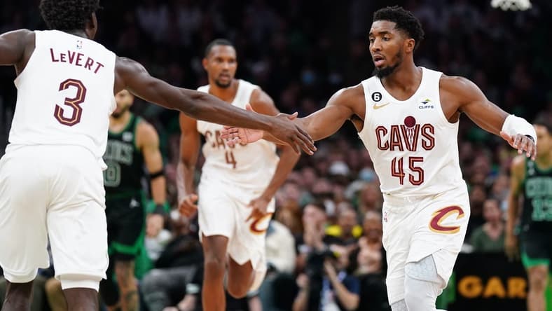 Oct 28, 2022; Boston, Massachusetts, USA; Cleveland Cavaliers guard Donovan Mitchell (45) reacts with guard Caris LeVert (3) against the Boston Celtics in the second half at TD Garden. Mandatory Credit: David Butler II-USA TODAY Sports