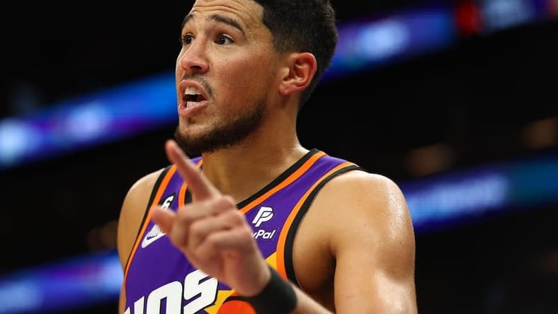 Oct 28, 2022; Phoenix, Arizona, USA; Phoenix Suns guard Devin Booker (1) reacts against the New Orleans Pelicans during the second half at Footprint Center. Mandatory Credit: Mark J. Rebilas-USA TODAY Sports