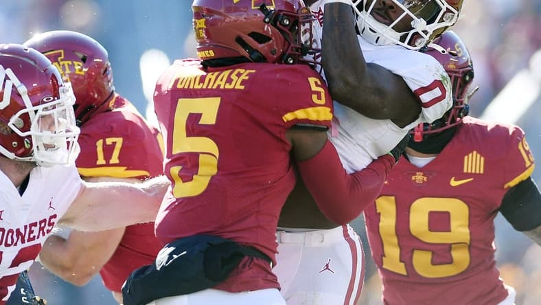 Oct 29, 2022; Ames, Iowa, USA;  Iowa State Cyclones defensive back Myles Purchase (5) knocks the ball out from Oklahoma Sooners running back Eric Gray (0) during the first quarter in the Big 12 Conference game  at Jack Trice Stadium. Mandatory Credit: Nirmalendu Majumdar/Ames Tribune-USA TODAY Sports