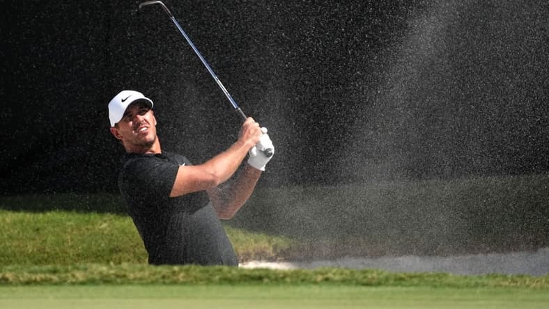 Oct 29, 2022; Miami, Florida, USA; Brooks Koepka plays his shot from the bunker on the 16th hole during the second round of the season finale of the LIV Golf series at Trump National Doral. Mandatory Credit: Jasen Vinlove-USA TODAY Sports
