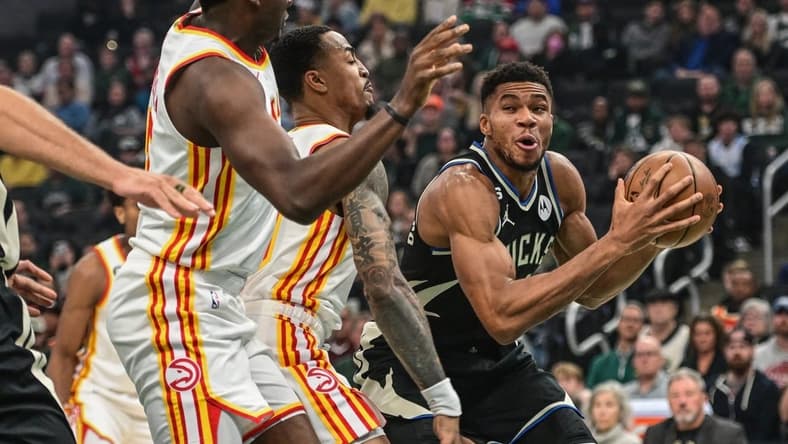Oct 29, 2022; Milwaukee, Wisconsin, USA; Milwaukee Bucks forward Giannis Antetokounmpo (34) looks for a shot against Atlanta Hawks center Clint Capela (15) and forward John Collins (20) in the first quarter at Fiserv Forum. Mandatory Credit: Benny Sieu-USA TODAY Sports
