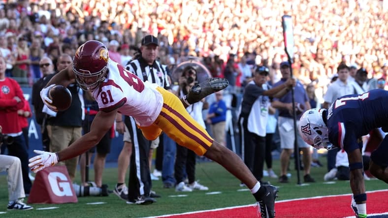 Oct 29, 2022; Tucson, Arizona, USA; USC Trojans wide receiver Kyle Ford (81) is unable to get his feet down for a catch against Arizona Wildcats cornerback Ephesians Prysock (7) during the first half at Arizona Stadium. Mandatory Credit: Joe Camporeale-USA TODAY Sports