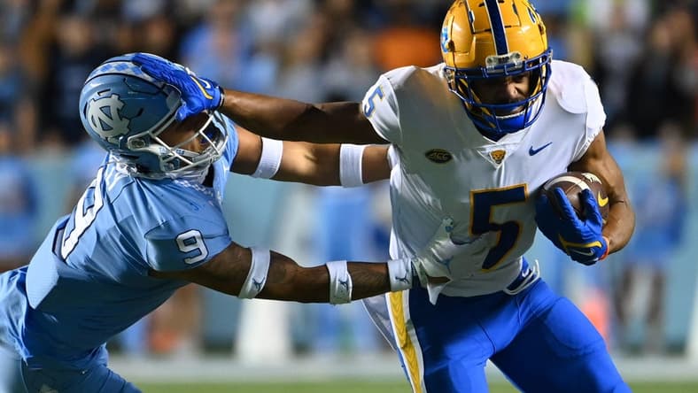 Oct 29, 2022; Chapel Hill, North Carolina, USA; Pittsburgh Panthers wide receiver Jared Wayne (5) with the ball as North Carolina Tar Heels defensive back Cam'Ron Kelly (9) defends in the second quarter at Kenan Memorial Stadium. Mandatory Credit: Bob Donnan-USA TODAY Sports