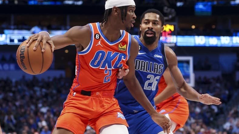 Oct 29, 2022; Dallas, Texas, USA; Oklahoma City Thunder guard Shai Gilgeous-Alexander (2) controls the ball as Dallas Mavericks guard Spencer Dinwiddie (26) defends during the second quarter at American Airlines Center. Mandatory Credit: Kevin Jairaj-USA TODAY Sports