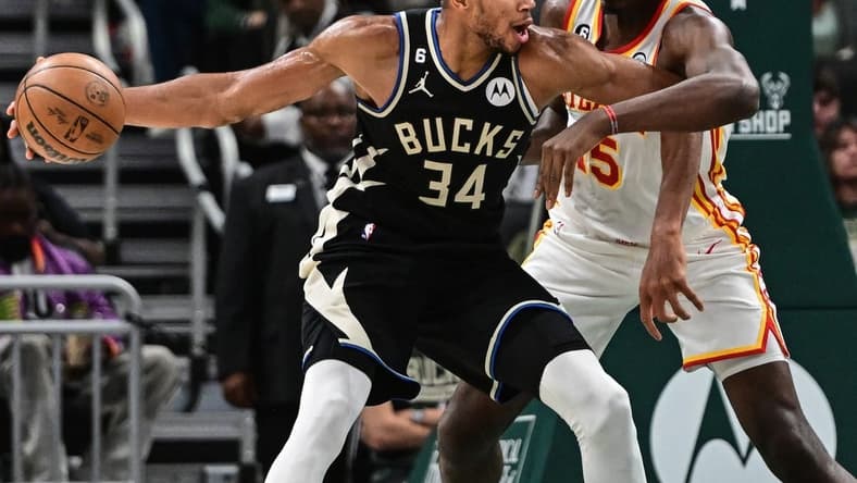 Oct 29, 2022; Milwaukee, Wisconsin, USA; Milwaukee Bucks forward Giannis Antetokounmpo (34) controls the ball against Atlanta Hawks center Clint Capela (15) in the fourth quarter at Fiserv Forum. Mandatory Credit: Benny Sieu-USA TODAY Sports