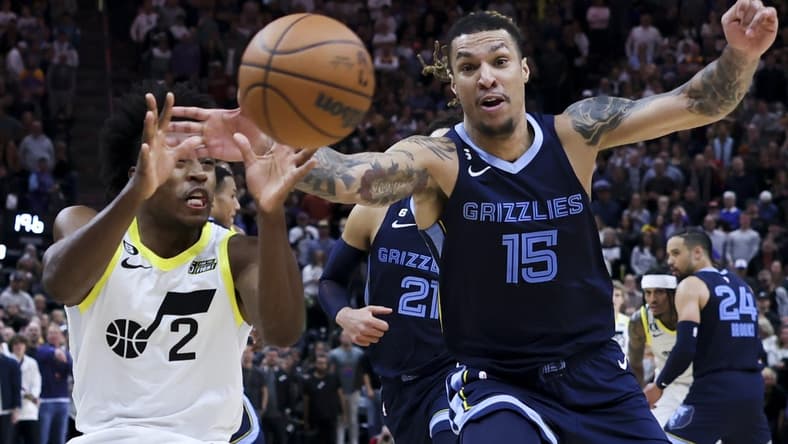 Oct 29, 2022; Salt Lake City, Utah, USA; Utah Jazz guard Collin Sexton (2) and Memphis Grizzlies forward Brandon Clarke (15) battle for a loose ball in the fourth quarter at Vivint Arena. Mandatory Credit: Rob Gray-USA TODAY Sports
