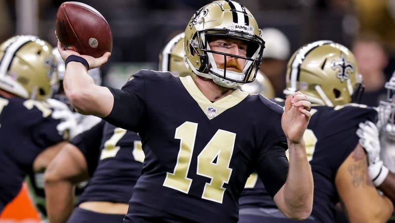 Oct 30, 2022; New Orleans, Louisiana, USA;  New Orleans Saints quarterback Andy Dalton (14) passes the ball against the Las Vegas Raiders during the first half at Caesars Superdome. Mandatory Credit: Stephen Lew-USA TODAY Sports