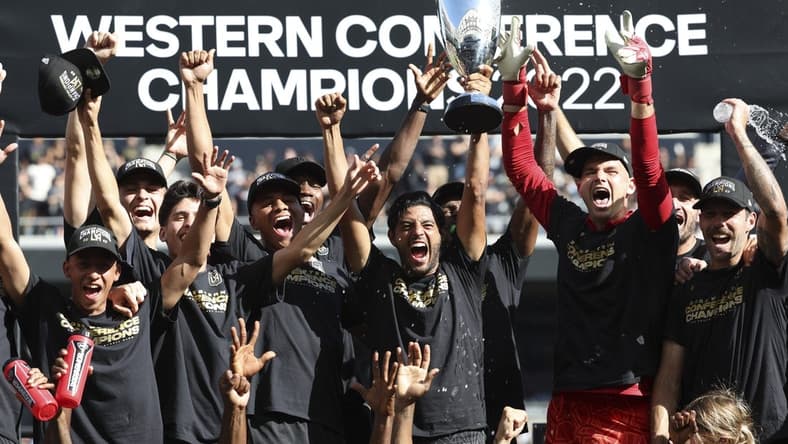 Oct 30, 2022; Los Angeles, California, USA; Los Angeles FC forward Carlos Vela (10) holds the cup as the Los Angeles FC celebrate the win over the Austin FC during the conference finals for the Audi 2022 MLS Cup Playoffs at Banc of California Stadium. Mandatory Credit: Kiyoshi Mio-USA TODAY Sports