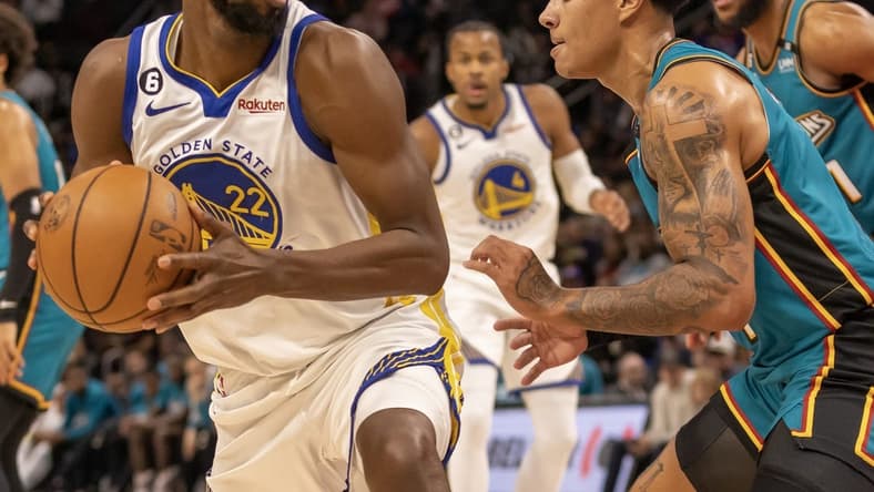 Oct 30, 2022; Detroit, Michigan, USA; Detroit Pistons guard Killian Hayes (7) defends against Golden State Warriors forward Andrew Wiggins (22) during the in the first half at Little Caesars Arena. Mandatory Credit: David Reginek-USA TODAY Sports