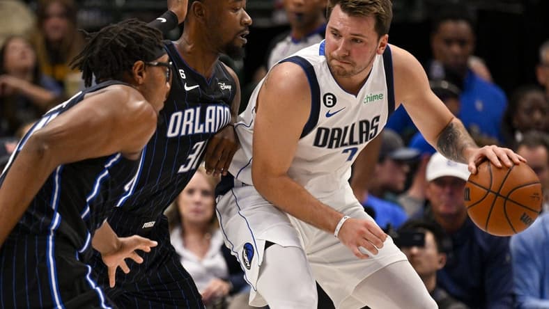 Oct 30, 2022; Dallas, Texas, USA; Orlando Magic guard Terrence Ross (31) defends against Dallas Mavericks guard Luka Doncic (77) during the first quarter at the American Airlines Center. Mandatory Credit: Jerome Miron-USA TODAY Sports