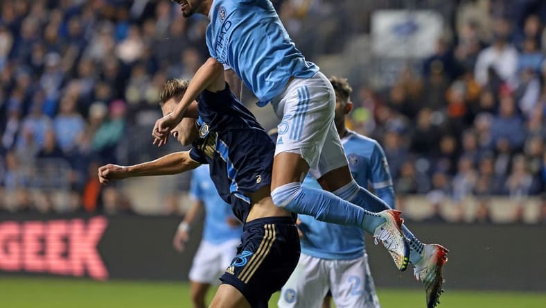 Oct 30, 2022; Philadelphia, Pennsylvania, USA; New York City defender Thiago Martins (5) heads the ball against Philadelphia Union defender Jack Elliott (3)  during the first half for the conference finals for the Audi 2022 MLS Cup Playoffs. Mandatory Credit: Vincent Carchietta-USA TODAY Sports