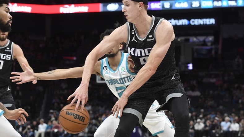 Oct 31, 2022; Charlotte, North Carolina, USA; Sacramento Kings guard forward Kevin Huerter (9) passes during the first half against the Charlotte Hornets at the Spectrum Center. Mandatory Credit: Sam Sharpe-USA TODAY Sports
