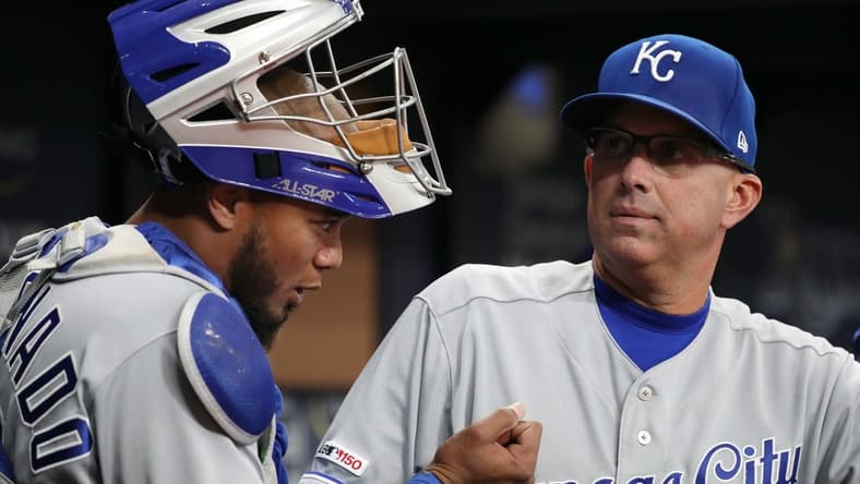Apr 22, 2019; St. Petersburg, FL, USA; Kansas City Royals catching coach Pedro Grifol (7) talks with catcher Martin Maldonado (16) at Tropicana Field. Mandatory Credit: Kim Klement-USA TODAY Sports