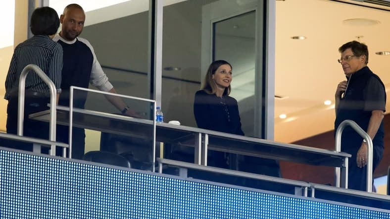 May 21, 2021; Miami, Florida, USA; from left: Miami Marlins general manager Kim Ng, and chief executive officer Derek Jeter, and chief operating officer Caroline O'Connor, and chairman & principal owner Bruce Sherman, attend a game against the New York Mets at loanDepot Park. Mandatory Credit: Sam Navarro-USA TODAY Sports