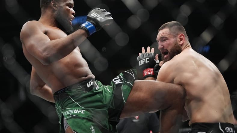 Mar 5, 2022; Las Vegas, Nevada, UNITED STATES; Nicolae Negumereanu (red gloves) fights Kennedy Nzechukwu (blue gloves) during UFC 272 at T-Mobile Arena. Mandatory Credit: Stephen R. Sylvanie-USA TODAY Sports