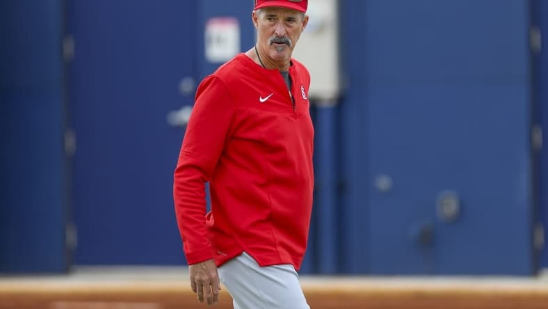 Mar 15, 2022; Jupiter, FL, USA; St. Louis Cardinals pitching coach Mike Maddux (35) walks toward the field during a spring training workout at Roger Dean Chevrolet stadium. Mandatory Credit: Sam Navarro-USA TODAY Sports