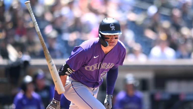 Jun 11, 2022; San Diego, California, USA; Colorado Rockies left fielder Sam Hilliard (22) tosses his bat after flying out during the fifth inning against the San Diego Padres at Petco Park. Mandatory Credit: Orlando Ramirez-USA TODAY Sports
