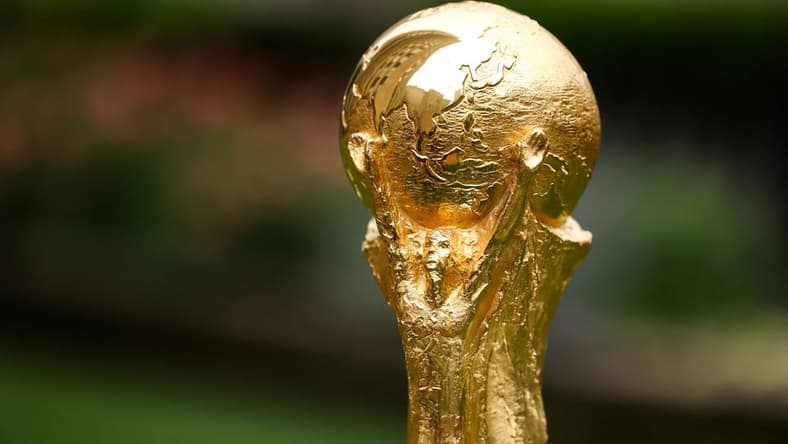 Jun 16, 2022; New York, New York, USA; A detail view of The FIFA World Cup Trophy sits on a stand outside of 30 Rockefeller Plaza. Mandatory Credit: Jessica Alcheh-USA TODAY Sports