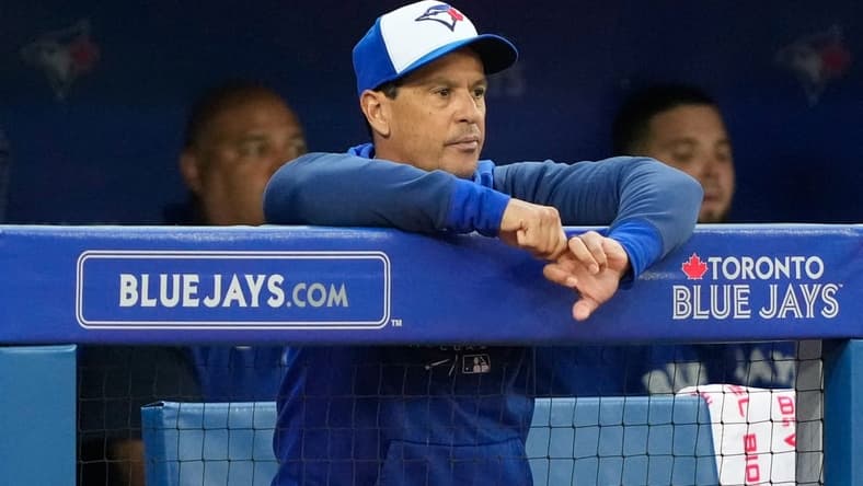 Jun 29, 2022; Toronto, Ontario, CAN; Toronto Blue Jays manager Charlie Montoyo (25) looks on from the dugout against the Boston Red Sox at Rogers Centre. Mandatory Credit: Kevin Sousa-USA TODAY Sports