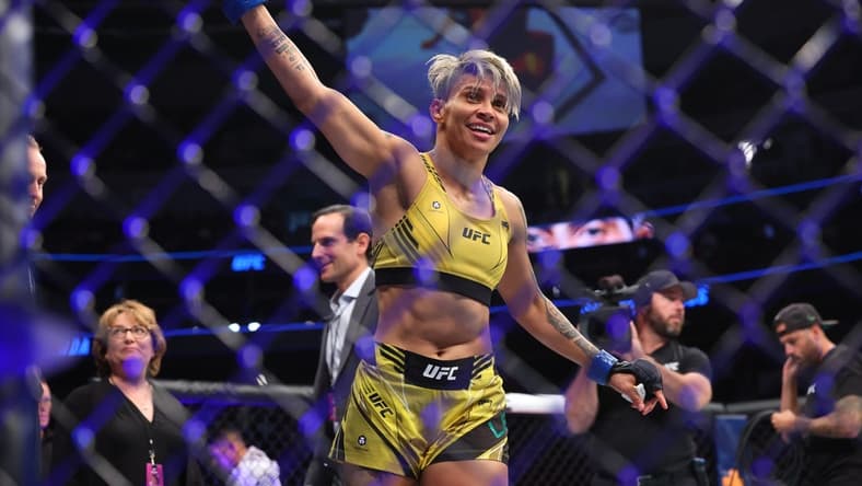 Jul 16, 2022; Elmont, New York, USA; Amanda Lemos (blue gloves) reacts to fight against Michelle Waterson-Gomez (red gloves) during UFC Fight Night at UBS Arena. Mandatory Credit: Ed Mulholland-USA TODAY Sports