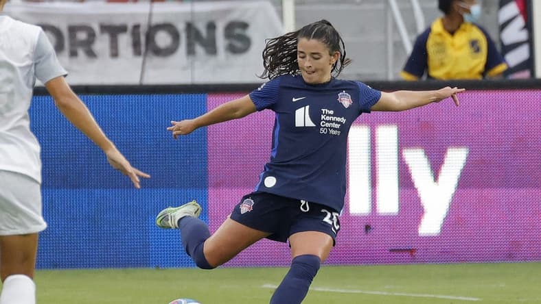 Jul 17, 2022; Washington, District of Columbia, USA; Washington Spirit midfielder Marissa Sheva (25) kicks the ball against Orlando Pride at Audi Field. Mandatory Credit: Geoff Burke-USA TODAY Sports