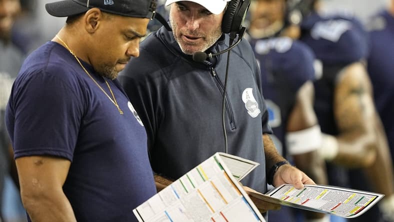 Aug 20, 2022; Toronto, Ontario, CAN; Toronto Argonauts head coach Ryan Dinwiddie talks to injured running back Andrew Harris (left) during the second half against the Calgary Stampeders at BMO Field. Mandatory Credit: John E. Sokolowski-USA TODAY Sports