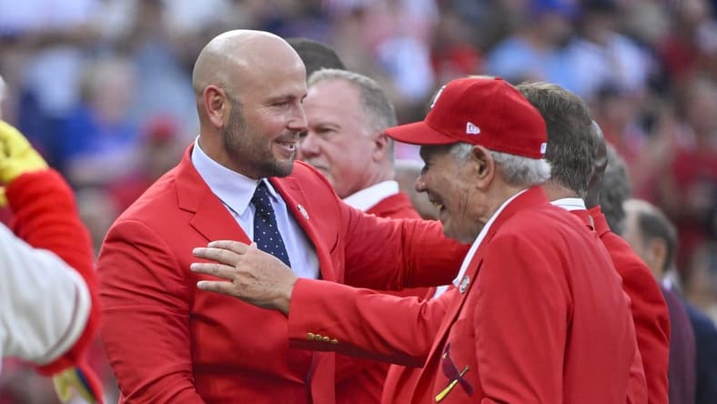 Aug 27, 2022; St. Louis, Missouri, USA; Former St. Louis Cardinals outfielder Matt Holliday celebrates with members of the Cardinals Red Jacket Club after he was inducted into the Cardinals Hall of Fame before a game against the Atlanta Braves at Busch Stadium. Mandatory Credit: Jeff Curry-USA TODAY Sports
