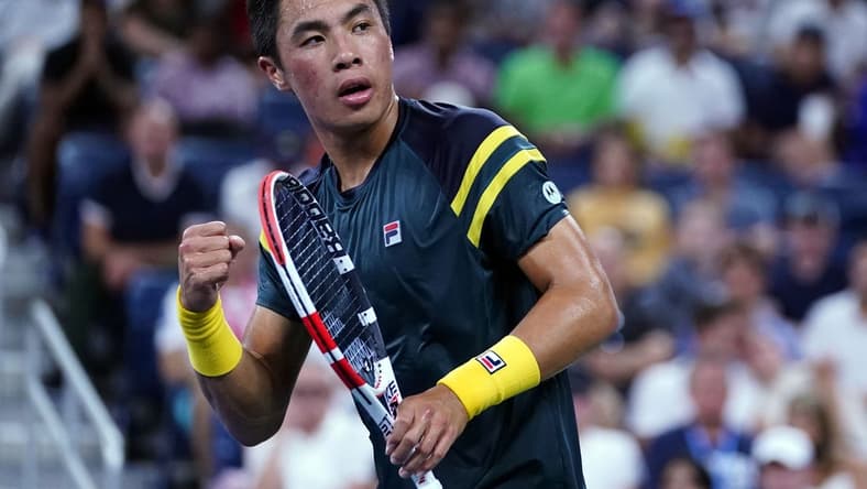 Sep 3, 2022; Flushing, NY, USA; Brandon Nakashima of the United States reacts after winning the first set against Jannik Sinner of Italy on day six of the 2022 U.S. Open tennis tournament at USTA Billie Jean King Tennis Center. Mandatory Credit: Danielle Parhizkaran-USA TODAY Sports
