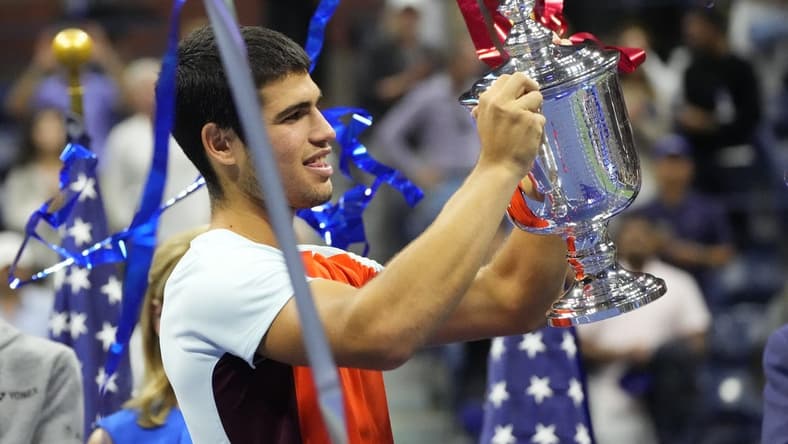 Sep 11, 2022; Flushing, NY, USA; Carlos Alcaraz (ESP) celebrates with the championship trophy after his match against Casper Ruud (NOR) (not pictured) in the men's singles final on day fourteen of the 2022 U.S. Open tennis tournament at USTA Billie Jean King Tennis Center. Mandatory Credit: Robert Deutsch-USA TODAY Sports