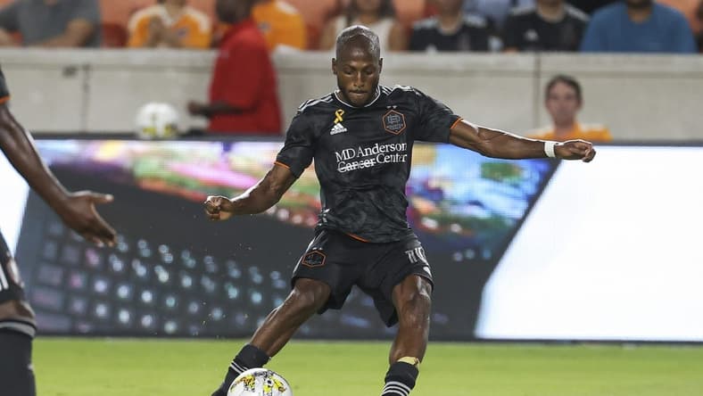 Sep 13, 2022; Houston, Texas, USA; Houston Dynamo FC midfielder Fafa Picault (10) kicks the ball during the second half against the New England Revolution at PNC Stadium. Mandatory Credit: Troy Taormina-USA TODAY Sports