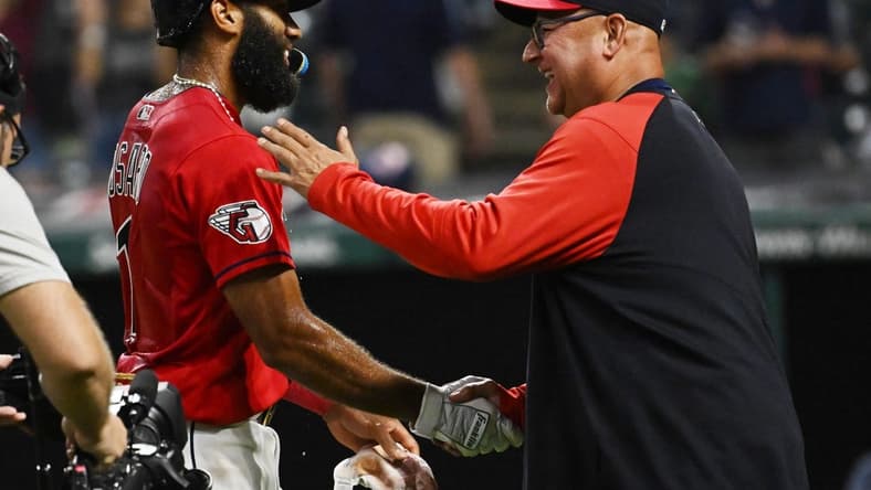 Sep 17, 2022; Cleveland, Ohio, USA; Cleveland Guardians shortstop Amed Rosario celebrates with manager Terry Francona, right, after hitting an RBI single to win the game during the fifteenth inning against the Minnesota Twins at Progressive Field. Mandatory Credit: Ken Blaze-USA TODAY Sports