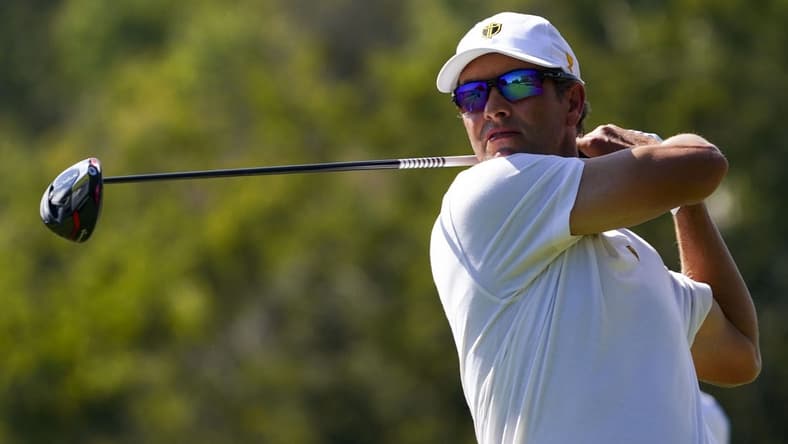 Sep 24, 2022; Charlotte, North Carolina, USA; International Team golfer Adam Scott hits his tee shot on the eighth hole during the four-ball match play of the Presidents Cup golf tournament at Quail Hollow Club. Mandatory Credit: Peter Casey-USA TODAY Sports