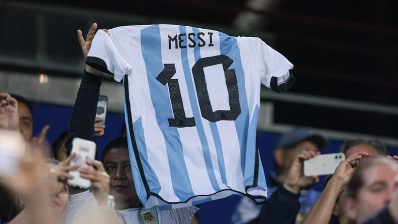 Sep 27, 2022; Harrison, New Jersey, USA; Argentina fans hold the jersey of forward Lionel Messi (not pictured) during the second half against Jamaica at Red Bull Arena. Mandatory Credit: Vincent Carchietta-USA TODAY Sports
