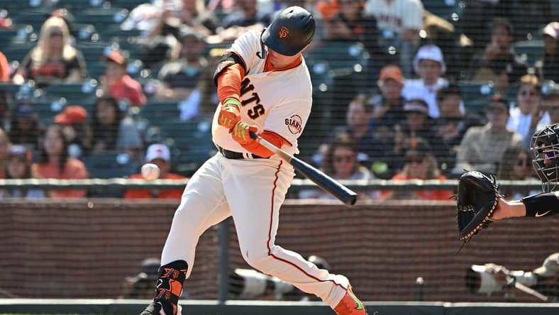 Oct 1, 2022; San Francisco, California, USA; San Francisco Giants right fielder Joc Pederson (23) hits a single against the Arizona Diamondbacks during the third inning at Oracle Park. Mandatory Credit: Robert Edwards-USA TODAY Sports
