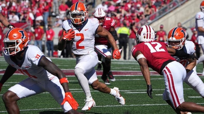 Illinois running back Chase Brown (2) finds a seam during the third quarter of their game Saturday, October 1, 2022 at Camp Randall Stadium in Madison, Wis. Illinois beat Wisconsin 34-10.

Uwgrid01 15