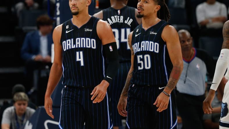 Oct 3, 2022; Memphis, Tennessee, USA; Orlando Magic guard Jalen Suggs (4) and guard Cole Anthony (50) walk to the bench during a timeout during the first half against the Memphis Grizzlies at FedExForum. Mandatory Credit: Petre Thomas-USA TODAY Sports