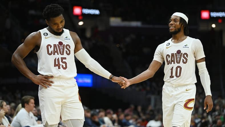 Oct 12, 2022; Cleveland, Ohio, USA; Cleveland Cavaliers guard Donovan Mitchell (45) and guard Darius Garland (10) shake hands after a play during the second half against the Atlanta Hawks at Rocket Mortgage FieldHouse. Mandatory Credit: Ken Blaze-USA TODAY Sports