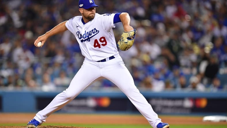 Oct 12, 2022; Los Angeles, California, USA; Los Angeles Dodgers relief pitcher Blake Treinen (49) throws during the eighth inning of game two of the NLDS for the 2022 MLB Playoffs against the San Diego Padres at Dodger Stadium. Mandatory Credit: Gary A. Vasquez-USA TODAY Sports
