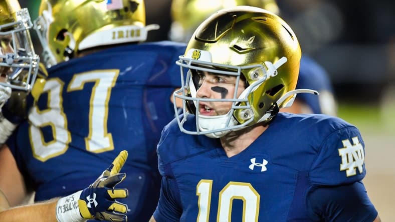 Oct 15, 2022; South Bend, Indiana, USA; Notre Dame Fighting Irish quarterback Drew Pyne (10) reacts after a touchdown in the third quarter against the Stanford Cardinal at Notre Dame Stadium. Mandatory Credit: Matt Cashore-USA TODAY Sports