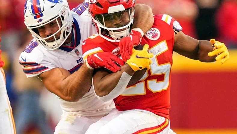 Oct 16, 2022; Kansas City, Missouri, USA; Kansas City Chiefs running back Clyde Edwards-Helaire (25) is tackled by Buffalo Bills linebacker Matt Milano (58) during the second half at GEHA Field at Arrowhead Stadium. Mandatory Credit: Jay Biggerstaff-USA TODAY Sports
