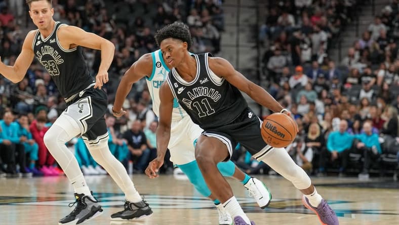 Oct 19, 2022; San Antonio, Texas, USA; San Antonio Spurs guard Joshua Primo (11) dribbles the ball in the first half against the Charlotte Hornets at the AT&T Center. Mandatory Credit: Daniel Dunn-USA TODAY Sports