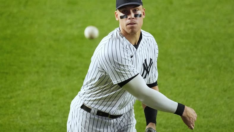 Oct 22, 2022; Bronx, New York, USA; New York Yankees right fielder Aaron Judge (99) warms up between the seventh inning and eighth inning against the Houston Astros during game three of the ALCS for the 2022 MLB Playoffs at Yankee Stadium. Mandatory Credit: Robert Deutsch-USA TODAY Sports
