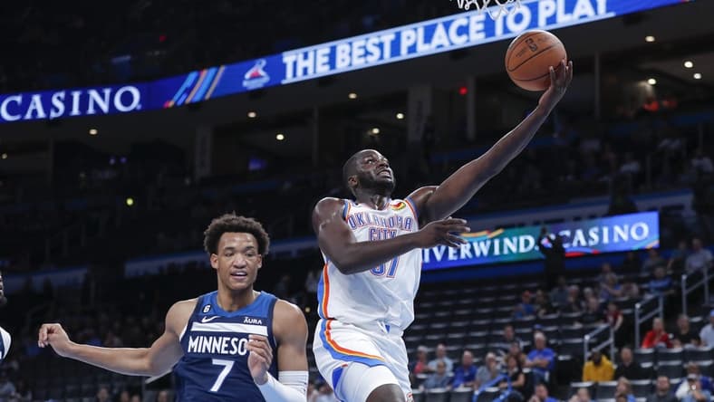 Oct 23, 2022; Oklahoma City, Oklahoma, USA; Oklahoma City Thunder forward Eugene Omoruyi (97) goes to the basket around Minnesota Timberwolves forward Wendell Moore Jr. (7) during the second half at Paycom Center. Minnesota won 116-106. Mandatory Credit: Alonzo Adams-USA TODAY Sports