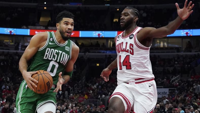 Oct 24, 2022; Chicago, Illinois, USA; Chicago Bulls forward Patrick Williams (44) defends Boston Celtics forward Jayson Tatum (0) during the second half at United Center. Mandatory Credit: David Banks-USA TODAY Sports