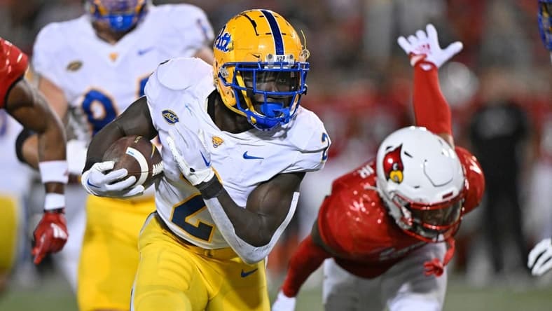 Oct 22, 2022; Louisville, Kentucky, USA;  Pittsburgh Panthers running back Israel Abanikanda (2) runs the ball against the Louisville Cardinals during the first half at Cardinal Stadium. Louisville defeated Pittsburgh 24-10. Mandatory Credit: Jamie Rhodes-USA TODAY Sports