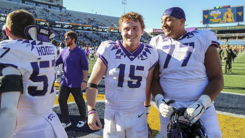 Oct 29, 2022; Morgantown, West Virginia, USA; TCU Horned Frogs quarterback Max Duggan (15) celebrates with teammates after defeating the West Virginia Mountaineers at Mountaineer Field at Milan Puskar Stadium. Mandatory Credit: Ben Queen-USA TODAY Sports