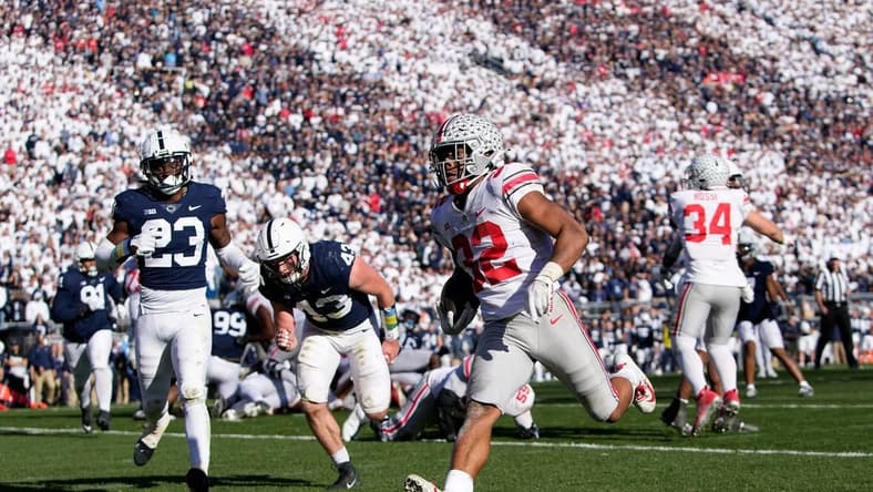 Oct 29, 2022; University Park, Pennsylvania, USA; Ohio State Buckeyes running back TreVeyon Henderson (32) runs for a 7-yard touchdown past Penn State Nittany Lions linebacker Tyler Elsdon (43) and linebacker Curtis Jacobs (23) during the fourth quarter of the NCAA Division I football game at Beaver Stadium. Mandatory Credit: Adam Cairns-The Columbus Dispatch
Ncaa Football Ohio State Buckeyes At Penn State Nittany Lions