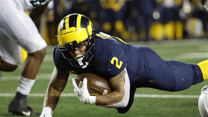 Oct 29, 2022; Ann Arbor, Michigan, USA; Michigan Wolverines running back Blake Corum (2) rushes for a touchdown in the first half against the Michigan State Spartans at Michigan Stadium. Mandatory Credit: Rick Osentoski-USA TODAY Sports