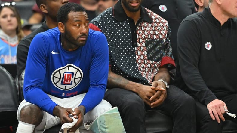 Oct 30, 2022; Los Angeles, California, USA;  Los Angeles Clippers forward Kawhi Leonard (2) sits next to guard John Wall (11) on from the bench in the first half at Crypto.com Arena. Mandatory Credit: Jayne Kamin-Oncea-USA TODAY Sports